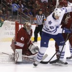 Toronto Maple Leafs right winger Troy Bodie (40) deflects the puck wide of Phoenix Coyotes goalie Mike Smith (41) in the first period during an NHL hockey game, Monday, Jan. 20, 2014, in Glendale, Ariz. (AP Photo/Rick Scuteri)