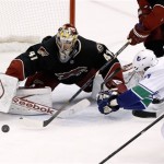 Phoenix Coyotes' Mike Smith (41) makes a save on a shot by Vancouver Canucks' Ryan Kesler during the third period of an NHL hockey game on Tuesday, Nov. 5, 2013, in Glendale, Ariz. The Coyotes defeated the Canucks 3-2 in a shootout. (AP Photo/Ross D. Franklin)