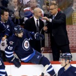 Winnipeg Jets' Assistant Coach Pascal Vincent and head coach Paul Maurice talk during first period NHL hockey action in Winnipeg, Canada, Monday, Jan. 13, 2014. (AP Photo/The Canadian Press, Trevor Hagan)