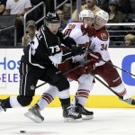 Phoenix Coyotes Michael Stone (26) and Tim Kennedy (34) collied as Los Angeles Kings Tyler Toffoli (73) controls the puck during the second period of an NHL hockey game at the Staples Center Sunday, April 15, 2013., in Los Angeles. (AP Photo/Kevork Djansezian)
