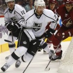 Los Angeles Kings center Jeff Carter (77) looks to center the puck against the Los Angeles Kings in the first period of an NHL hockey game Saturday, Jan. 26, 2013, in Glendale, Ariz. (AP Photo/Rick Scuteri)
