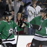  Dallas Stars' Ray Whitney (13) is congratulated on his goal by Brenden Dillon (4) in the first period of an NHL hockey game against the Phoenix Coyotes, Saturday, Feb. 8, 2014, in Dallas. (AP Photo/Tony Gutierrez)