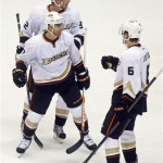 Anaheim Ducks center Andrew Cogliano, middle, celebrates with Toni Lydman (32) of Finland, and Ben Lovejoy (6) after scoring his second goal of the game against the Phoenix Coyotes during an NHL hockey game Saturday, March 2, 2013, in Glendale, Ariz. (AP Photo/Rick Scuteri)