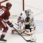 Chicago Blackhawks goalie Ray Emery (30) makes a save on a shot by Phoenix Coyotes' David Moss (18) during the second period in an NHL hockey game, Thursday, Feb. 7, 2013, in Glendale, Ariz. The Blackhawks won 6-2. (AP Photo/Ross D. Franklin)