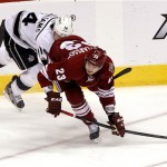 Phoenix Coyotes defenseman Oliver Ekman-Larsson (23) and Los Angeles Kings right wing Justin Williams (14) battle for the puck during the first period of Game 2 of the NHL hockey Stanley Cup Western Conference finals, Tuesday, May 15, 2012, in Glendale, Ariz. (AP Photo/Ross D. Franklin)