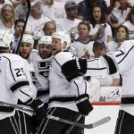Los Angeles Kings' Mike Richards (10) celebrates his goal against the Phoenix Coyotes with Dustin Penner (25), Alec Martinez (27), Matt Greene and Jeff Carter (77) in the second period during Game 5 of the NHL hockey Stanley Cup Western Conference finals, Tuesday, May 22, 2012, in Glendale, Ariz. (AP Photo/Ross D. Franklin)