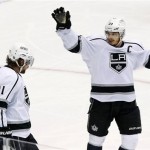 Los Angeles Kings' Anze Kopitar (11), of Slovenia, celebrates his goal against the Phoenix Coyotes with Dustin Brown (23) in the first period during Game 5 of the NHL hockey Stanley Cup Western Conference finals, Tuesday, May 22, 2012, in Glendale, Ariz. (AP Photo/Ross D. Franklin)

