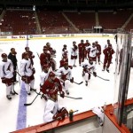 Phoenix Coyotes head coach Dave Tippett, far right, talks to his players during NHL hockey training camp, Tuesday, Jan. 15, 2013, in Glendale, Ariz. (AP Photo/Ross D. Franklin)