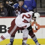 Colorado Avalanche left wing Cody McLeod (55) swings at Phoenix Coyotes center Kyle Chipchura (24) during a fight in the first period of an NHL hockey game, Monday, Feb. 11, 2013, in Denver. (AP Photo/Joe Mahoney)
