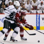 Phoenix Coyotes right wing Mikkel Boedker, right, battles Los Angeles Kings center Anze Kopitar for the puck during the first period of Game 5 of the NHL hockey Stanley Cup Western Conference finals, Tuesday, May 22, 2012, in Glendale, Ariz. (AP Photo/Matt York)