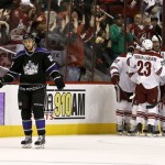 Los Angeles Kings' Trevor Lewis (22) skates away as Phoenix Coyotes' Oliver Ekman-Larsson (23), of Sweden; Raffi Torres (37); Michael Stone, right; and Martin Hanzal, second from right, of the Czech Republic, celebrate a goal by Mikkel Boedker during the first period of an NHL hockey game Tuesday, March 12, 2013, in Glendale, Ariz. (AP Photo/Ross D. Franklin)