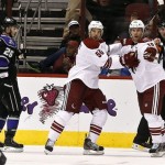 Phoenix Coyotes' Shane Doan, right, celebrates his goal with teammate Antoine Vermette as Los Angeles Kings' Slava Voynov (26), of Russia, skates past in the first period during an NHL hockey game Tuesday, March 12, 2013, in Glendale, Ariz. (AP Photo/Ross D. Franklin)