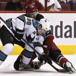 San Jose Sharks' Logan Couture (39) battles Phoenix Coyotes' Martin Hanzal (11), of the Czech Republic, for the puck after a face off in the first period during an NHL hockey game, on Monday, April 15, 2013 in Glendale, Ariz. (AP Photo/Ross D. Franklin)