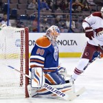  Phoenix Coyotes' Martin Hanzal (11) is stopped by Edmonton Oilers goalie Ilya Bryzgalov (80) during the first period of an NHL hockey game Friday, Jan. 24, 2014, in Edmonton, Alberta. (AP Photo/The Canadian Press, Jason Franson)