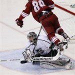 Phoenix Coyotes right wing Mikkel Boedker (89) tries to avoid Los Angeles Kings goalie Jonathan Quick during the third period of Game 5 of the NHL hockey Stanley Cup Western Conference finals, Tuesday, May 22, 2012, in Glendale, Ariz. (AP Photo/Matt York)