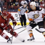 Arizona Coyotes' David Moss (18) loses the puck in front of Anaheim Ducks' Ryan Getzlaf (15) during the first period of an NHL hockey game Tuesday, March 3, 2015, in Glendale, Ariz. (AP Photo/Ross D. Franklin)