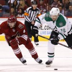 Dallas Stars' Erik Cole (72) skates with the puck in front of Arizona Coyotes' Tobias Rieder (8), of Germany, during the first period of an NHL hockey game Tuesday, Nov. 11, 2014, in Glendale, Ariz. (AP Photo/Ross D. Franklin)