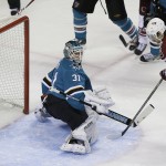 Arizona Coyotes center Antoine Vermette, right, scores a power play goal against San Jose Sharks goalie Antti Niemi, left, during the first period of an NHL hockey game Saturday, Nov. 22, 2014, in San Jose, Calif. (AP Photo/Eric Risberg)