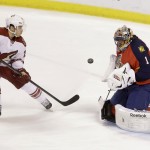  Phoenix Coyotes center Andy Miele attempts a shot against Florida Panthers goalie Roberto Luongo (1) during the first period of an NHL hockey game, Tuesday, March 11, 2014, in Sunrise, Fla. (AP Photo/Wilfredo Lee)