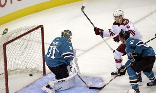 A shot from Arizona Coyotes’ Justin Hodgeman, not pictured, gets past San Jose Sharks goalie ...