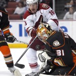 Arizona Coyotes right wing Shane Doan, left, tries to get a shot in against Anaheim Ducks goalie Frederik Andersen, of Denmark, during the first period of an NHL hockey game, Friday, Nov. 7, 2014, in Anaheim, Calif. (AP Photo/Mark J. Terrill)