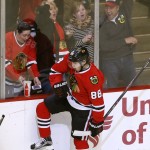 Chicago Blackhawks right wing Patrick Kane celebrates his goal, the 200th of his career, during the second period of an NHL hockey game against the Arizona Coyotes on Tuesday, Jan. 20, 2015, in Chicago. (AP Photo/Charles Rex Arbogast)
