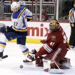 Arizona Coyotes' Mike Smith (41) makes a save on a shot as St. Louis Blues' Jaden Schwartz (17) looks on during the first period of an NHL hockey game Tuesday, Jan. 6, 2015, in Glendale, Ariz. (AP Photo/Ross D. Franklin)
