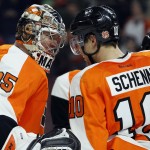 Philadelphia Flyers Steve Mason (35), left, and Brayden Schenn (10), right, celebrate the win in the overtime shoot-out of an NHL hockey game, Tuesday, Jan. 27, 2015, in Philadelphia. The Flyers won 4-3. (AP Photo/Tom Mihalek)