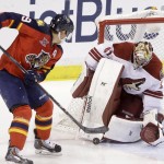  Phoenix Coyotes goalie Mike Smith blocks a shot from Florida Panthers right wing Scottie Upshall during the first period of an NHL hockey game, Tuesday, March 11, 2014, in Sunrise, Fla. (AP Photo/Wilfredo Lee)