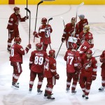 The Phoenix Coyotes players wave their sticks as they acknowledge the crowd after an NHL hockey game against the Dallas Stars on Sunday, April 13, 2014, in Glendale, Ariz. The Coyotes defeated the Stars 2-1. (AP Photo/Ross D. Franklin)