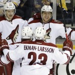 Arizona Coyotes left wing Martin Erat (10), of the Czech Republic, celebrates with Lauri Korpikoski (28), of Finland; Keith Yandle (3) and Oliver Ekman-Larsson (23), of Sweden, after scoring a goal against the Nashville Predators in the third period of an NHL hockey game Tuesday, Oct. 21, 2014, in Nashville, Tenn. (AP Photo/Mark Humphrey)