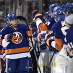 New York Islanders left wing Matt Martin (17) celebrates his goal with his teammates in the third period of an NHL hockey game at Nassau Coliseum on Tuesday, Feb. 24, 2015, in Uniondale, N.Y. The Islanders won 5-1. (AP Photo/Kathy Kmonicek)