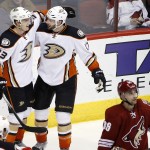 Anaheim Ducks' Jakob Silfverberg (33), of Sweden, smiles as he celebrates his goal against the Arizona Coyotes with Ryan Kesler (17) as Coyotes' Mark Arcobello (36) skates away during the third period of an NHL hockey game Tuesday, March 3, 2015, in Glendale, Ariz. The Ducks won 4-1. (AP Photo/Ross D. Franklin)