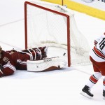 Carolina Hurricanes' Elias Lindholm (16), of Sweden, scores against Arizona Coyotes' Mike Smith during the shootout of an NHL hockey game Thursday, Feb. 5, 2015, in Glendale, Ariz. The Hurricanes defeated the Coyotes 2-1 in a shootout. (AP Photo/Ross D. Franklin)