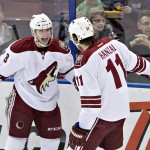 Arizona Coyotes' Tobias Rieder (8) and Martin Hanzal (11) celebrate a goal against the Edmonton Oilers during the second period of an NHL hockey game in Edmonton, Alberta, on Monday, Dec. 1, 2014. (AP Photo/The Canadian Press, Jason Franson)