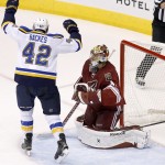 St. Louis Blues' David Backes (42) celebrates a goal by teammate Jaden Schwartz against Arizona Coyotes' Mike Smith, right, during the second period of an NHL hockey game Saturday, Oct. 18, 2014, in Glendale, Ariz. (AP Photo/Ross D. Franklin)