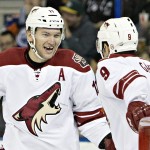 Arizona Coyotes' Martin Hanzal (11) and Sam Gagner (9) celebrate a goal against the Edmonton Oilers during the first period of an NHL hockey game in Edmonton, Alberta, Tuesday, Dec. 23, 2014. (AP Photo/The Canadian Press, Jason Franson)
