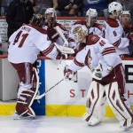 Arizona Coyotes goalie Devan Dubnyk, right, enters the game in relief of goalie Mike Smith, who was pulled during second period of an NHL hockey game against the Vancouver Canucks in Vancouver, British Columbia, Monday, Dec. 22, 2014. (AP Photo/The Canadian Press, Darryl Dyck)