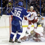 Tampa Bay Lightning right wing Nikita Kucherov (86), of Russia, shoots the puck past a dive by Arizona Coyotes goalie Mike Smith during the second period of an NHL hockey game Tuesday, Oct. 28, 2014, in Tampa, Fla. (AP Photo/Chris O'Meara)