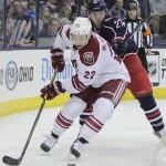 Arizona Coyotes' Brandon McMillan, front, controls the puck as Columbus Blue Jackets' Ryan Murray defends during the first period of an NHL hockey game Tuesday, Feb. 3, 2015, in Columbus, Ohio. (AP Photo/Jay LaPrete)
