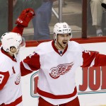 Detroit Red Wings' Tomas Tatar (21), of the Czech Republic, celebrates his goal against the Arizona Coyotes with Pavel Datsyuk (13), of Russia, during the third period of an NHL hockey game Saturday, Feb. 7, 2015, in Glendale, Ariz. The Red Wings defeated the Coyotes 3-1. (AP Photo/Ross D. Franklin)