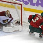 Arizona Coyotes goalie Mike Smith blocks a shot by Minnesota Wild's Charlie Coyle during the third period of an NHL hockey game, Thursday, Oct. 23, 2014, in St. Paul, Minn. The Wild won 2-0. (AP Photo/Jim Mone)
