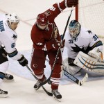 Arizona Coyotes' Shane Doan (19) tries to redirect the puck as San Jose Sharks' Justin Braun (61) defends in front of Sharks goalie Antti Niemi (31), of Finland, during the third period of an NHL hockey game Tuesday, Jan. 13, 2015, in Glendale, Ariz. The Sharks defeated the Coyotes 3-2. (AP Photo/Ross D. Franklin)