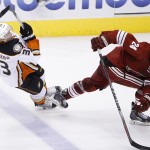 Arizona Coyotes' Kyle Chipchura (24) gets tangled up with Anaheim Ducks' Jakob Silfverberg (33), of Sweden, during the second period of an NHL hockey game Tuesday, March 3, 2015, in Glendale, Ariz. (AP Photo/Ross D. Franklin)