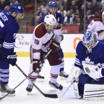 Arizona Coyotes' Shane Doan (19) looks for a rebound as Toronto Maple Leafs goalie Jonathan Bernier makes a save and Maple Leafs' Korbinian Holzer (55) defends during the first period of an NHL hockey game Thursday, Jan. 29, 2015, in Toronto. (AP Photo/The Canadian Press, Frank Gunn)
