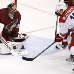 Arizona Coyotes' Mike Smith (41) makes a save on a shot by Carolina Hurricanes' Jay McClement (18) during the second period of an NHL hockey game Thursday, Feb. 5, 2015, in Glendale, Ariz. (AP Photo/Ross D. Franklin)