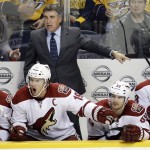 Arizona Coyotes head coach Dave Tippett protests a call in the second period of an NHL hockey game against the Nashville Predators Tuesday, Oct. 21, 2014, in Nashville, Tenn. (AP Photo/Mark Humphrey)