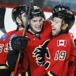Calgary Flames' David Jones, right, celebrates his goal with teammate Sean Monahan during first period NHL hockey action against the Arizona Coyotes in Calgary, Alberta, Tuesday, Dec. 2, 2014. (AP Photo/The Canadian Press, Jeff McIntosh)
