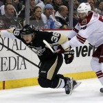Phoenix Coyotes' Antoine Vermette (50) checks Pittsburgh Penguins' Jussi Jokinen (36) during the second period of an NHL hockey game in Pittsburgh, Tuesday, March 25, 2014. (AP Photo/Gene J. Puskar)
