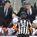 Arizona Coyotes associate coach Jim Playfair, left, and head coach Dave Tippett have a word with the referee during second period NHL hockey action against the Edmonton Oilers in Edmonton, on Sunday, Nov. 16, 2014. (AP Photo/The Canadian Press, Jason Franson)